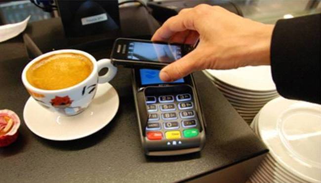 Person using NFC payment on smartphone